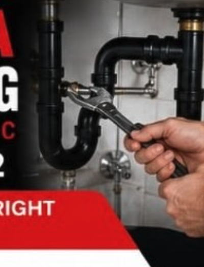 Skilled plumber with wrench working on pipes